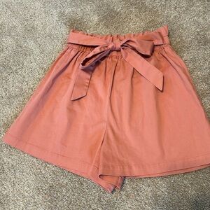 Women’s size small bowtie front shorts, pale, rust color